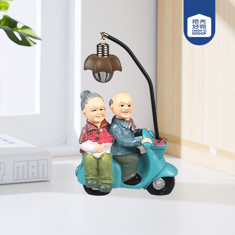 Old Couple in scooter