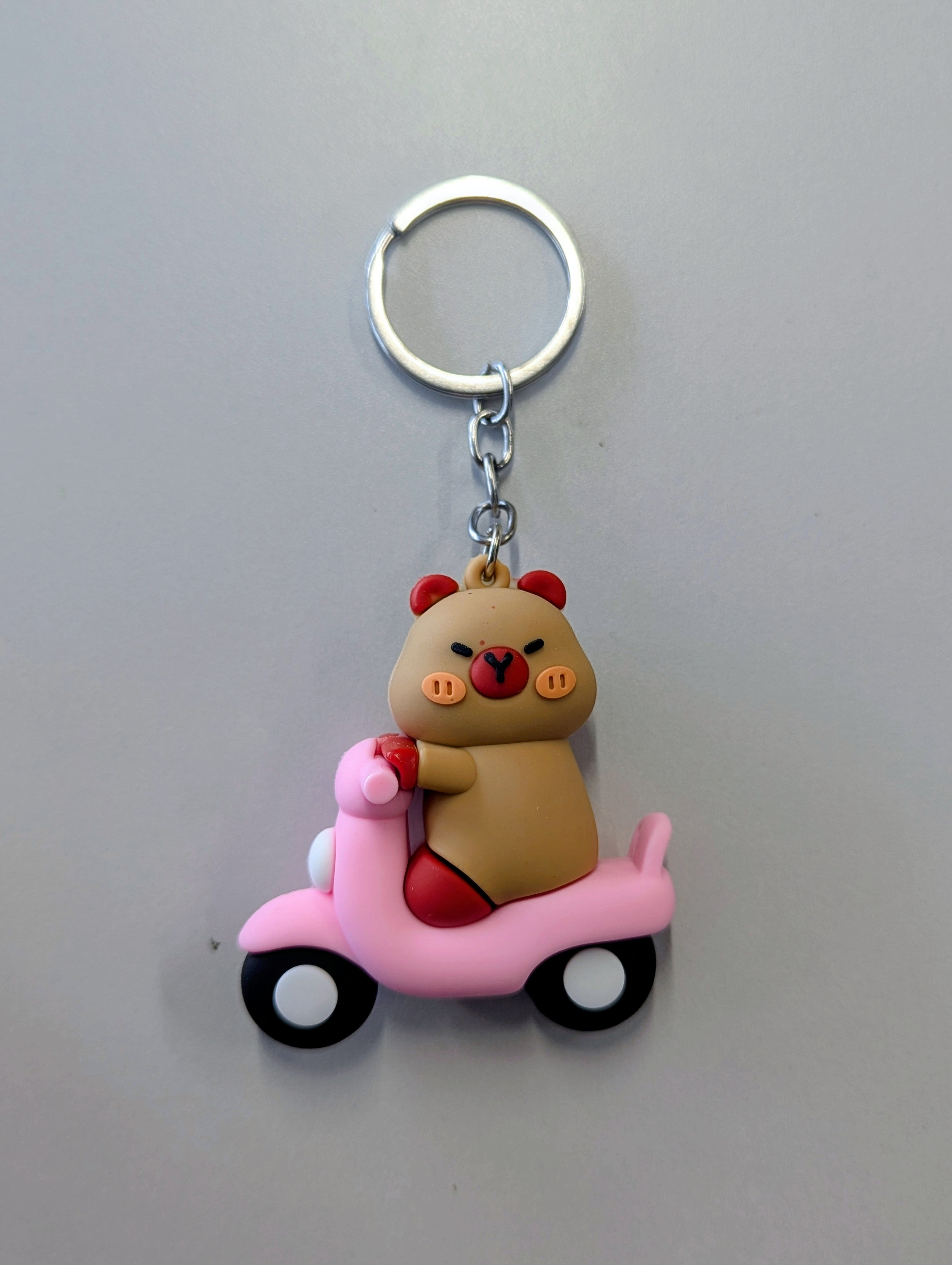 Capybara in scooter keychain