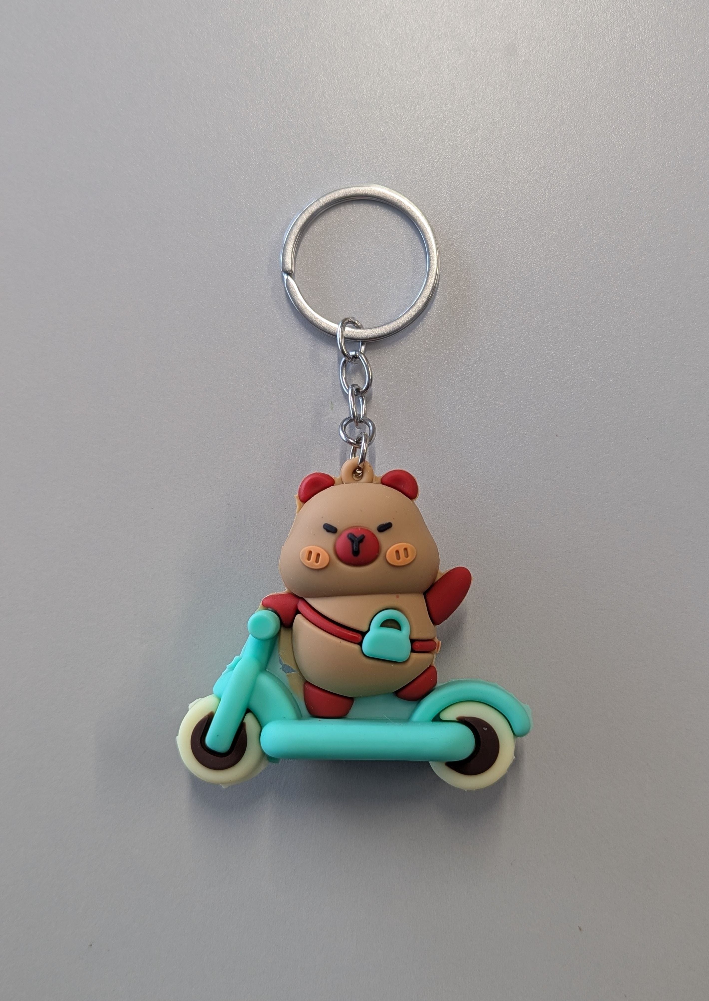 Capybara in scooter keychain